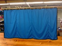 blue curtain single wooden floor